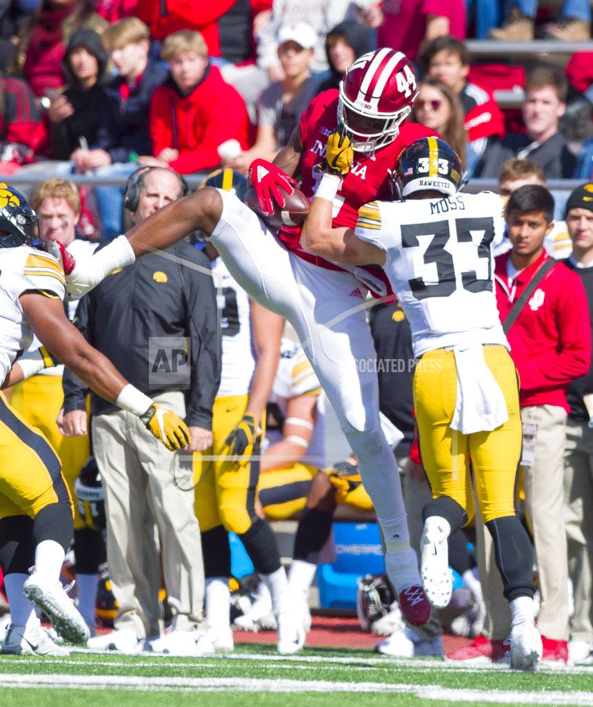 Doug Mcschooler Indiana wide receiver Donavan Hale (6) catches a pass for a first down as he's hit by Iowa defensive back Riley Moss (33) during the second half of an NCAA college football game Saturday, Oct. 13, 2018, in Bloomington, Ind. Iowa won 42-16. (AP Photo/Doug McSchooler)