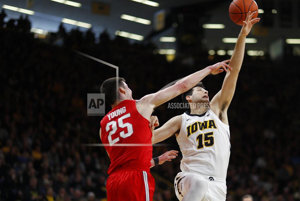 Matthew Putney Ohio State forward Kyle Young, left, and Iowa forward Ryan Kriener, right, battle for a rebound during the first half of an NCAA college basketball game, Saturday, Jan. 12, 2019, in Iowa City, Iowa. (AP Photo/Matthew Putney)