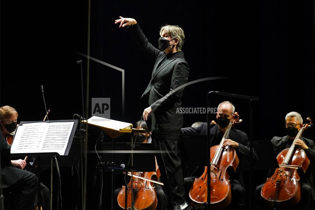 Kathy Willens CORRECTS SPELLING OF FIRST NAME TO ESA INSTEAD OF ESSA - Guest conductor Esa-Pekka Salonen, music director of the San Francisco Symphony and principal conductor of London's Philharmonia Orchestra, leads the New York Philharmonic as the orchestra perform together before a live audience of 150 people for the first time since March 10, 2020, at The Shed in Hudson Yards, Wednesday, April 14, 2021, in New York. (AP Photo/Kathy Willens)