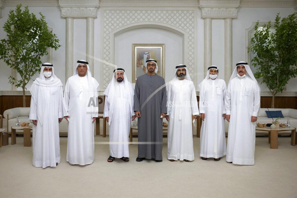 Hamad Al Kaabi This photo from Ministry of Presidential Affairs shows from left to right, Sheikh Hamad bin Mohammed Al Sharqi, Supreme Council Member and Ruler of Fujairah, Sheikh Saud bin Saqr Al Qasimi, Supreme Council Member and Ruler of Ras Al Khaimah, Dr. Sheikh Sultan bin Muhammad Al Qasimi, Supreme Council Member and Ruler of Sharjah, Sheikh Mohamed bin Zayed Al Nahyan, President of the United Arab Emirates and Ruler of the Emirate of Abu Dhabi, Sheikh Mohammed bin Rashid Al Maktoum, Vice President, Prime Minister and Ruler of Dubai, Sheikh Humaid bin Rashid Al Nuaimi, Supreme Council Member and Ruler of Ajman and Sheikh Saud bin Rashid Al Mu'alla, Supreme Council Member and Ruler of Umm Al Qaiwain pose for a photo as Mohamed bin Zayed accepts their condolences, Saturday, May14, 2022. (Ministry of Presidential Affairs via AP/Hamad Al Kaabi)