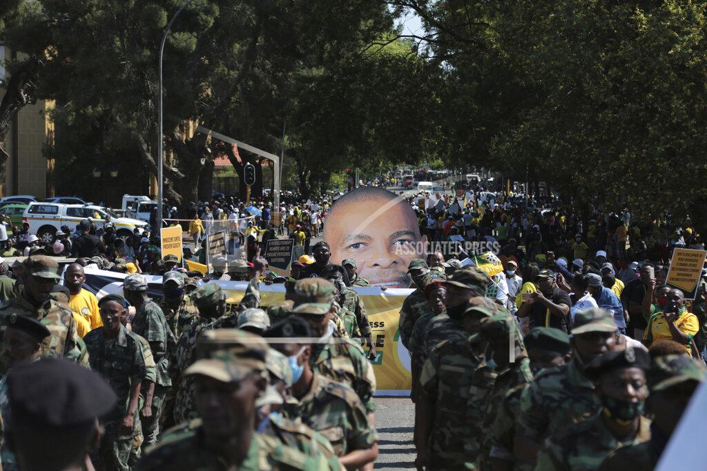 Uncredited Supporters for African National Congress secretary general Ace Magashule protest outside the magistrates court during a bail hearing for Magashulein Bloemfontein, South Africa, Friday, Nov. 13, 2020. Magashule is charged in connection with the looting of $13.8 million when he was premier of the Free State province from 2009 until 2018. (AP Photo)