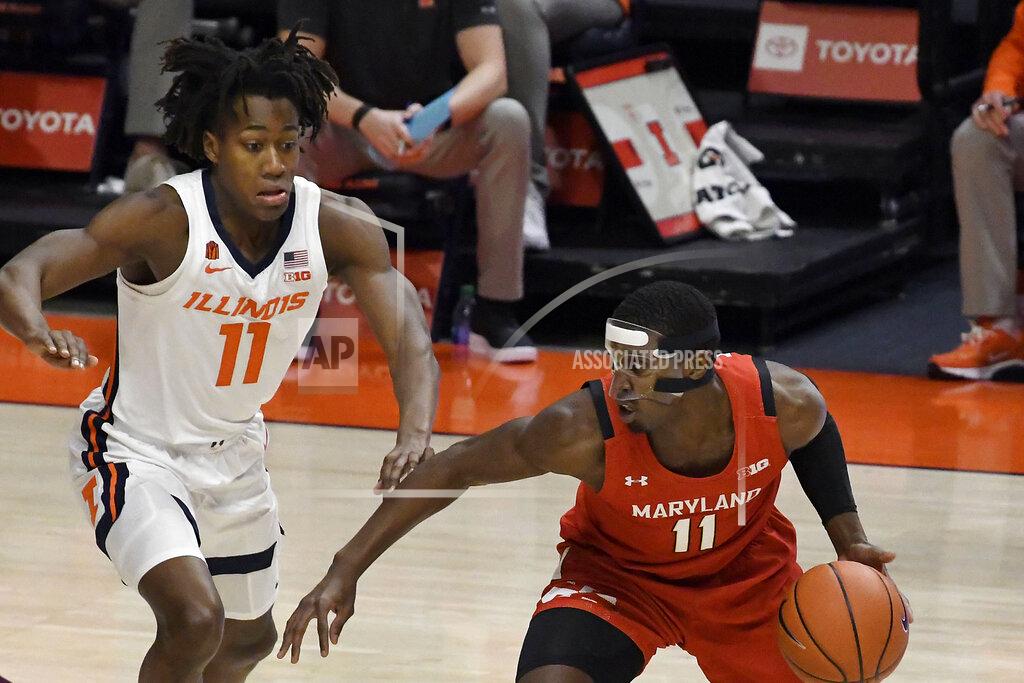 Holly Hart Maryland's guard Darryl Morsell (11) is pressured by Illinois guard Ayo Dosunmu (11) in the first half of an NCAA college basketball game Sunday, Jan. 10, 2021, in Champaign, Ill. (AP Photo/Holly Hart)