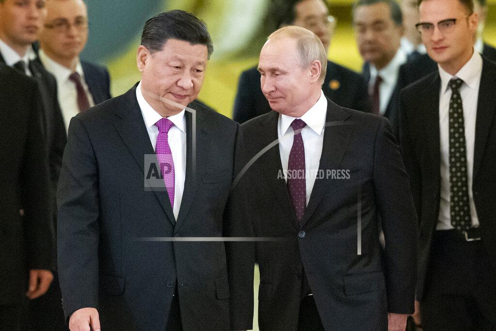 Alexander Zemlianichenko FILE - In this June 5, 2019, file photo, Russian President Vladimir Putin, center right, and Chinese President Xi Jinping, center left, enter a hall for talks in the Kremlin in Moscow, Russia. Putin and Xi have developed strong personal ties helping bolster a “strategic partnership” between the two former Communist rivals. (AP Photo/Alexander Zemlianichenko, Pool, File)