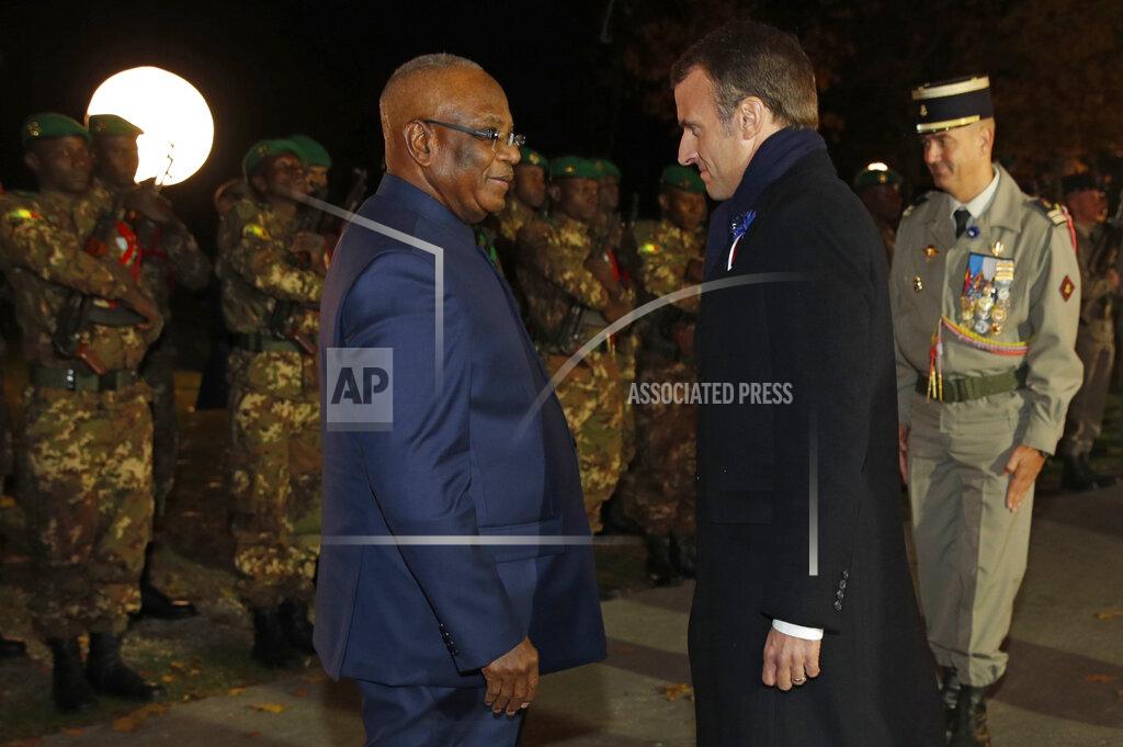 Philippe Wojazer FILE - In this Tuesday, Nov. 6, 2018 file photo, French President Emmanuel Macron, right, faces Mali's President Ibrahim Boubacar Keita, left, as they arrive to attend a military ceremony at the Parc de Champagne in Reims, Eastern France, as part of a World War One commemoration tour. Mutinous soldiers surrounded the private residence of Mali's President Ibrahim Boubacar Keita on Tuesday, Aug. 18, 2020 firing shots into the air and deepening fears of a coup attempt following several months of demonstrations calling for his resignation. (Philippe Wojazer/Pool via AP, File)