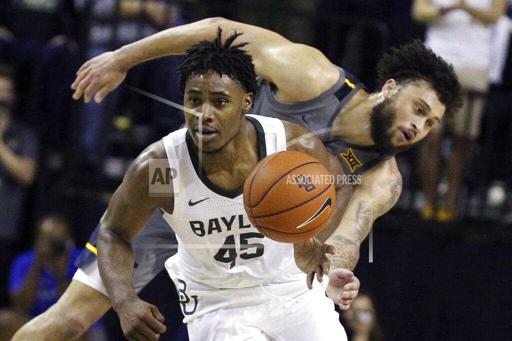 Rod Aydelotte Baylor guard Davion Mitchell, left, breaks away from West Virginia guard Jermaine Haley for a fast break in the second half of an NCAA college basketball game, Saturday, Feb. 15, 2020, in Waco, Texas. (AP Photo/Rod Aydelotte)