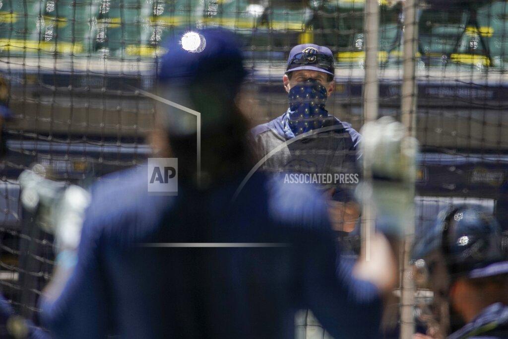 Morry Gash Milwaukee Brewers manager Craig Counsell watches batters during a practice session Monday, July 13, 2020, at Miller Park in Milwaukee. (AP Photo/Morry Gash)