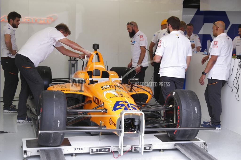 Michael Conroy The team of Fernando Alonso, of Spain, works on his car in the garage area during practice for the Indianapolis 500 IndyCar auto race at Indianapolis Motor Speedway, Thursday, May 16, 2019 in Indianapolis. Alonso, heavily damaged his car in a cr yesterday. (AP Photo/Michael Conroy)