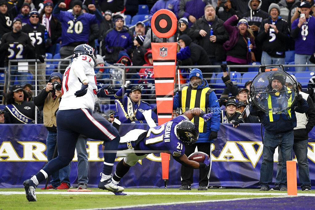 Nick Wass Baltimore Ravens running back Mark Ingram (21) dives in for a touchdown on a pass from quarterback Lamar Jackson, not visible, during the second half of an NFL football game against the Houston Texans, Sunday, Nov. 17, 2019, in Baltimore. (AP Photo/Nick Wass)