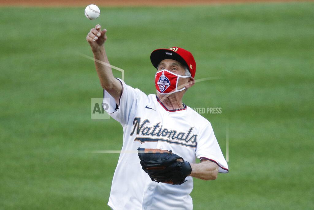 Alex Brandon Ceremonial first pitch is thrown by Dr. Anthony Fauci, Director of the National Institute of Allergy and Infectious Diseases before the start of the during the first inning of an opening day baseball game between the New York Yankees and Washington Nationals at Nationals Park, Thursday, July 23, 2020, in Washington. (AP Photo/Alex Brandon)