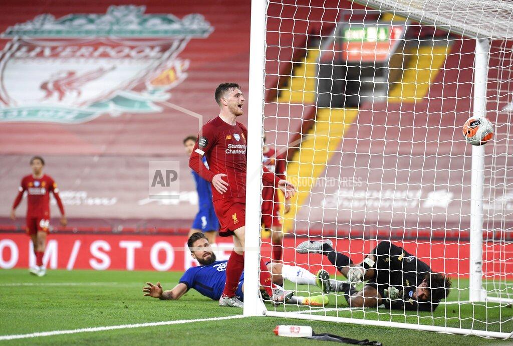 Laurence Griffiths Chelsea's Olivier Giroud, bottom center, scores his side's opening goal during the English Premier League soccer match between Liverpool and Chelsea at Anfield stadium in Liverpool, England, Wednesday, July 22, 2020. (Laurence Griffiths, Pool via AP)