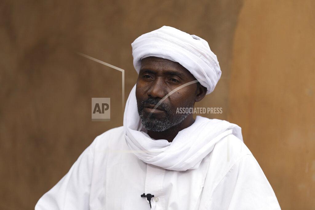 Marwan Ali Abdullah Jaber, whose son Mubarak died in a migrant ship sinking last month, sits at his home in Khartoum, Sudan, Friday, April 30 2021. When more than 100 Africans hoping to reach Europe on a rubber boat called repeatedly for help in late April, a rescue never came. In all, approximately 130 people are believed to have died off the Libyan coast. It was the deadliest wreck so far this year in the Mediterranean Sea and has renewed accusations that European countries are failing to help migrant boats in trouble. (AP Photo/Marwan Ali)