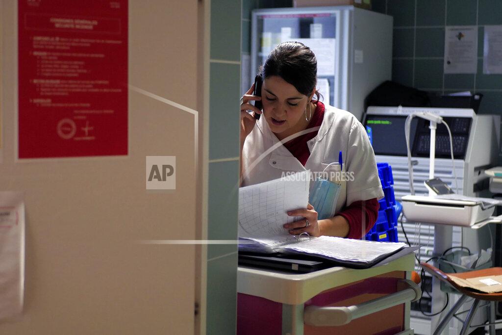 Thibault Camus Nurse Elodie Proust gets a phone call at the emergency ward of the Rouvray psychiatric hospital, in Rouen, western France, Wednesday, Nov. 25, 2020. Lockdowns that France has used to fight the coronavirus have come at considerable cost to mental health. Surveying points to a surge of depression most acute among people without work, in financial hardship and young adults. (AP Photo/Thibault Camus)