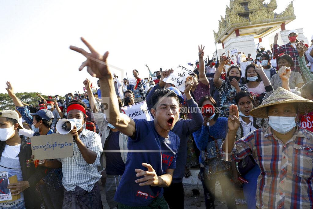 Uncredited FILE - In this Feb. 10, 2021, file photo, demonstrators flash a three-fingered symbol of resistance against the military coup and shout slogans calling for the release of detained Myanmar leader Aung San Suu Kyi during a protest in Mandalay, Myanmar. When army generals in Myanmar staged a coup last week, they briefly cut internet access in an apparent attempt to stymie protests. Around the world, shutting down the internet has become an increasingly popular tactic by repressive and authoritarian regimes and some illiberal democracies. (AP Photo, File)