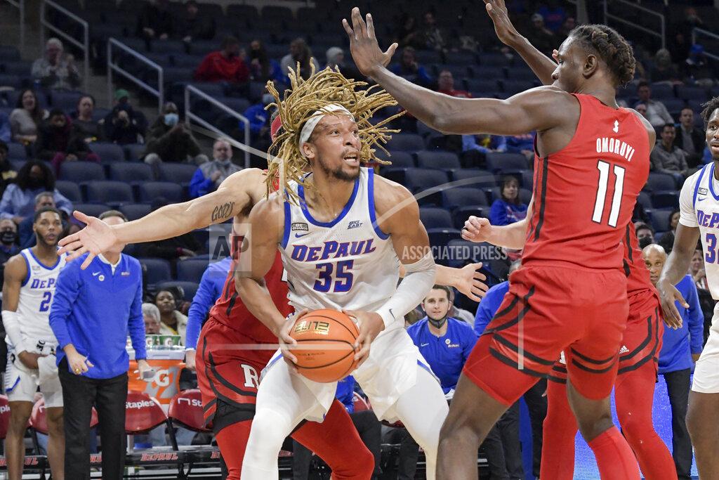 Mark Black DePaul's Brandon Johnson (35) works to pass the ball to Yor Anei for the basket against Rutgers during the second half of an NCAA college basketball game Thursday, Nov. 18, 2021, in Chicago. (AP Photo/Mark Black)
