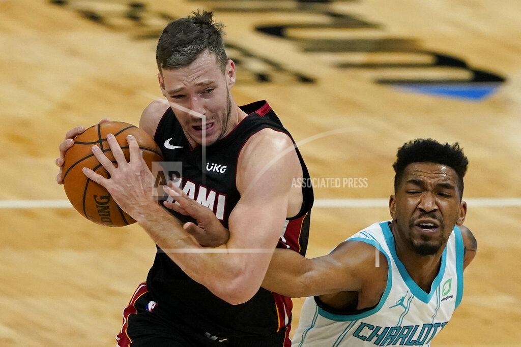 Chris Carlson Charlotte Hornets guard Malik Monk, right, fouls Miami Heat guard Goran Dragic during the first half of an NBA basketball game on Sunday, May 2, 2021, in Charlotte, N.C. (AP Photo/Chris Carlson)
