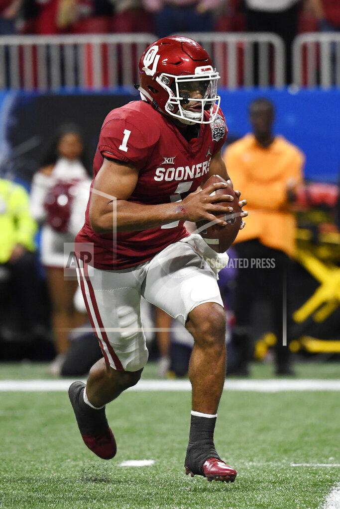 Danny Karnik Oklahoma quarterback Jalen Hurts (1) runs against LSU during the first half of the Peach Bowl NCAA semifinal college football playoff game, Saturday, Dec. 28, 2019, in Atlanta. (AP Photo/Danny Karnik)