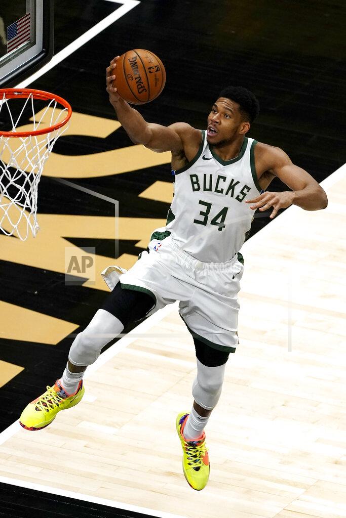 John Bazemore Milwaukee Bucks forward Giannis Antetokounmpo (34) goes in for a basket during the first half of the team's NBA basketball game against the Atlanta Hawks on Thursday, April 15, 2021, in Atlanta. (AP Photo/John Bazemore)