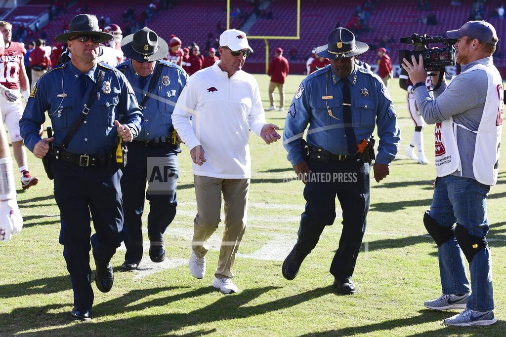 Arkansas coach Chad Morris heads to the locker room after the Razorbacks' 45-19 loss to Western Kentucky in an NCAA college football game, Saturday, Nov. 9, 2019, in Fayetteville, Ark. (AP Photo/Michael Woods)