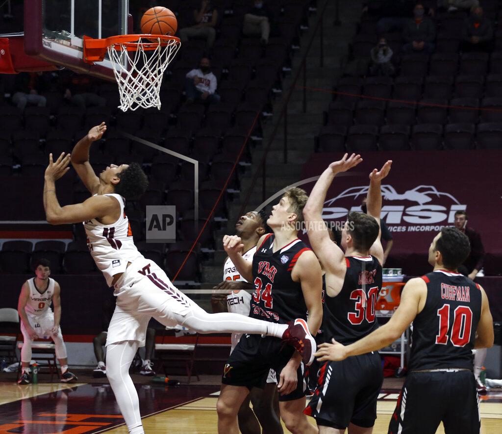 Matt Gentry Virginia Tech's Keve Aluma (22) scores after driving into the lane past VMI's Jake Stephens (34) Sean Conway (30) and Kamdyn Curfman (10) during the second half of an NCAA college basketball game, Thursday, Dec. 3, 2020 in Blacksburg, Va. (Matt Gentry/The Roanoke Times via AP, Pool)