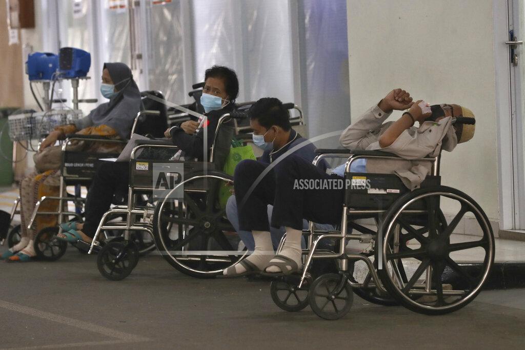 Tatan Syuflana People wait for medical treatment outside an emergency ward amid a surge of COVID-19 patients at Cengkareng Regional General Hospital in Jakarta, Indonesia, Thursday, June 24, 2021. The world's fourth most populous country, has seen COVID-19 infections surge in recent weeks, putting pressure on hospitals, including in the capital city, where most of hospital beds are full, and has added urgency to the government's plan to inoculate 1 million people each day by next month. (AP Photo/Tatan Syuflana)