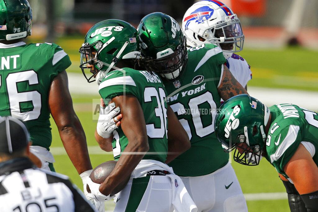 Jeffrey T. Barnes New York Jets running back Josh Adams, left center, celebrates his touchdown with Connor McGovern (60) during the second half of an NFL football game against the Buffalo Bills in Orchard Park, N.Y., Sunday, Sept. 13, 2020. (AP Photo/Jeffrey T. Barnes)