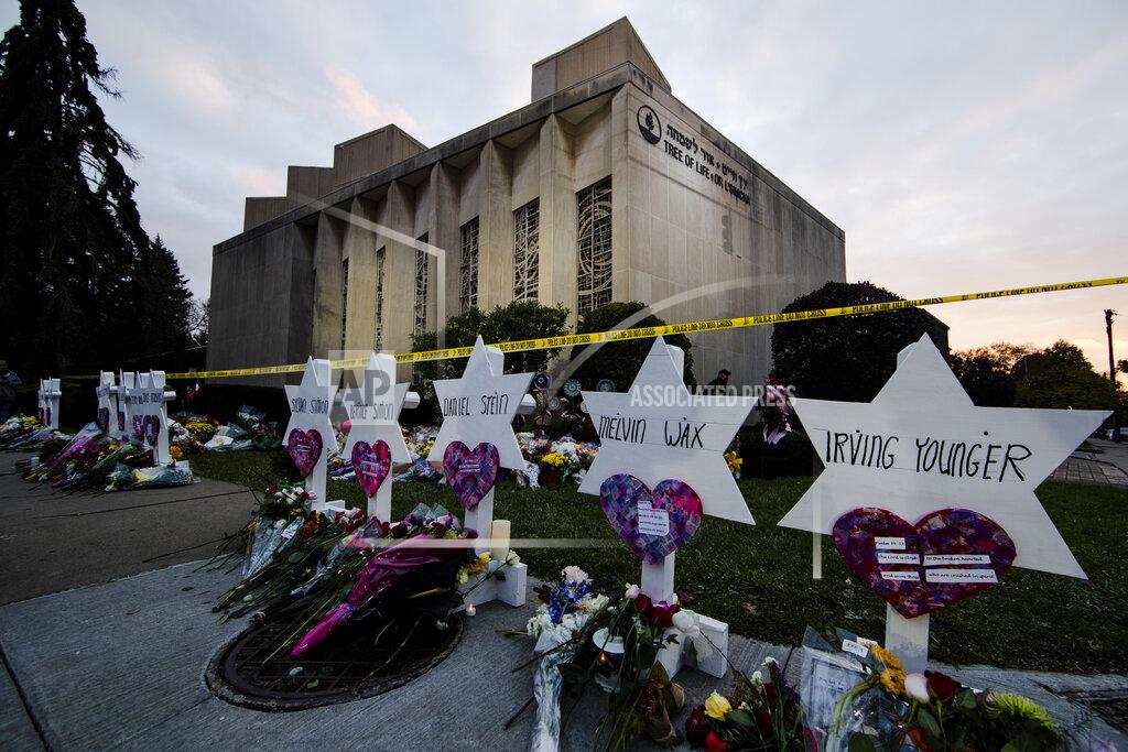 Matt Rourke FILE - In this Oct. 29, 2018 file photo, a makeshift memorial stands outside the Tree of Life Synagogue in the aftermath of a deadly shooting at the in Pittsburgh. Organizers have strived to offer emotional support during the second anniversary commemorations. One-on-one counseling will be offered virtually, and there's a tent set up near the synagogue where people can access in-person support from humans and comfort dogs. (AP Photo/Matt Rourke, File)
