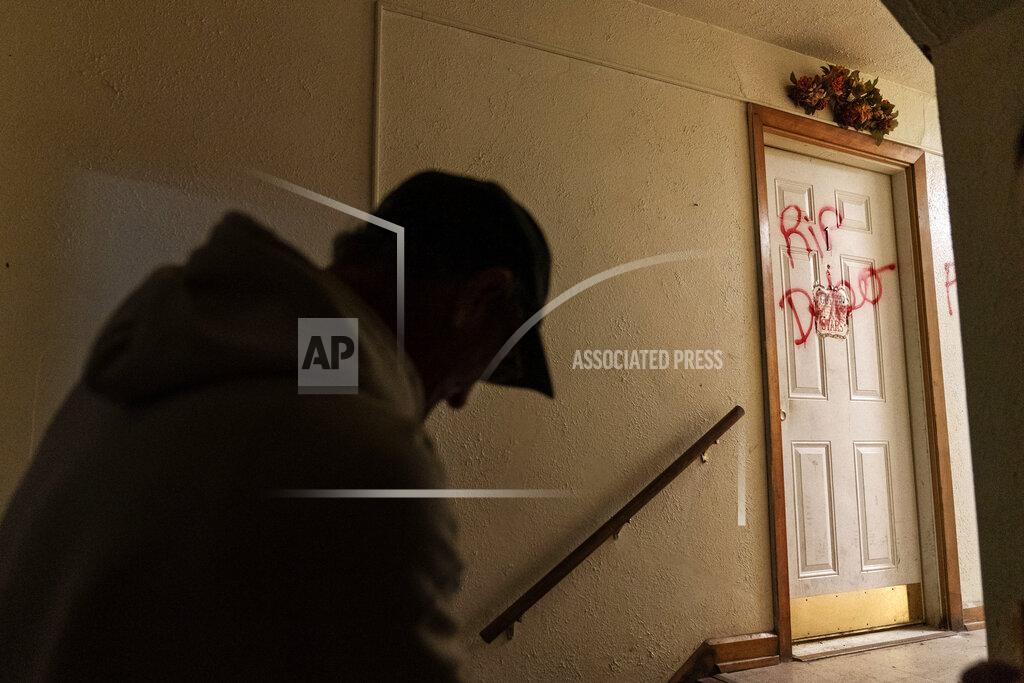 David Goldman The message "RIP Debo" is spray painted on the apartment door that had been the home of 41-year-old Debbie Barnette, a mother of three, in Huntington, W.Va., Thursday, March 18, 2021. Barnette, bold and headstrong, had struggled with addiction all her life. She overdosed many times and developed the infections that often follow injection drug use. By the time she sought treatment, the infection in her heart was too far gone to save. Lying in a hospice bed, her sister, Lesa, had to tell her she was dying. Debbie asked her why. "The drugs got you, babe," Lesa remembers saying. "They got you." The only peace Lesa has is that now she's finally free. (AP Photo/David Goldman)