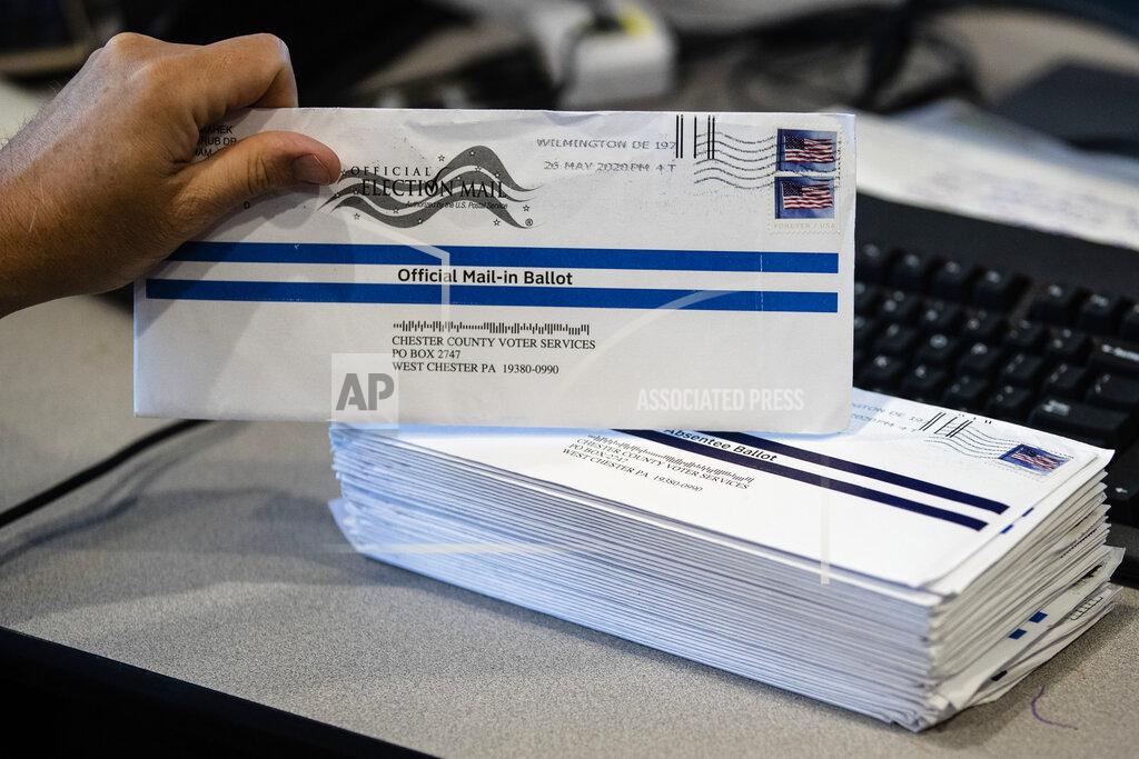 Matt Rourke Dave Turnier processes mail-in ballots at at the Chester County Voter Services office in West Chester, Pa., prior to the primary election, Thursday, May 28, 2020. (AP Photo/Matt Rourke)