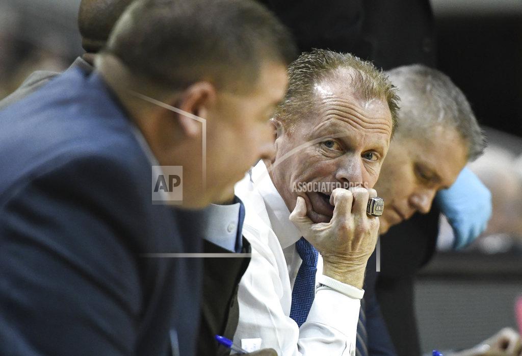 Julie Bennett North Florida coach Matthew Driscoll talks to staff on the bench during the first half of the team's NCAA college basketball game against Auburn on Saturday, Dec. 29, 2018, in Auburn, Ala. (AP Photo/Julie Bennett)