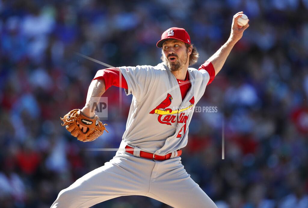 FILE - In this Sept. 12, 2019, file photo, St. Louis Cardinals relief pitcher Andrew Miller works against the Colorado Rockies during the seventh inning of a baseball game in Denver. Major League Baseball players are upset over the prospect teams may seek additional pay cuts if games are played in empty ballparks due to the coronavirus outbreak. There is little chance for a full 162-game schedule, and players stand to forfeit from $222,222 for each game missed to $3,478 for those at the $563,500 minimum. Miller, a member of the union’s eight-man executive committee, would lose $70,988 per game of his $11.5 million salary. (AP Photo/David Zalubowski, File)