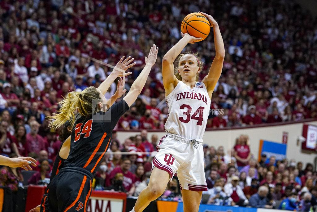 Michael Conroy Indiana guard Grace Berger (34) shoots over Princeton guard Julia Cunningham (24) in the second half of a college basketball game in the second round of the NCAA tournament in Bloomington, Ind., Monday, March 21, 2022. Indiana defeated Princeton 56-55. (AP Photo/Michael Conroy)