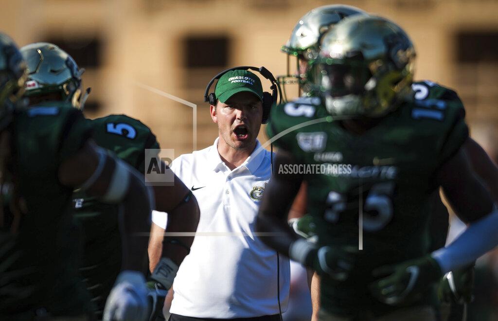 Allison Lee Isley Charlotte head coach Will Healy directs his players in the third quarter of an NCAA college football game against Appalachian State in Boone, N.C., Saturday, Sept. 7, 2019 Appalachian State won, 56-41. (Allison Lee Isley/The Winston-Salem Journal via AP)