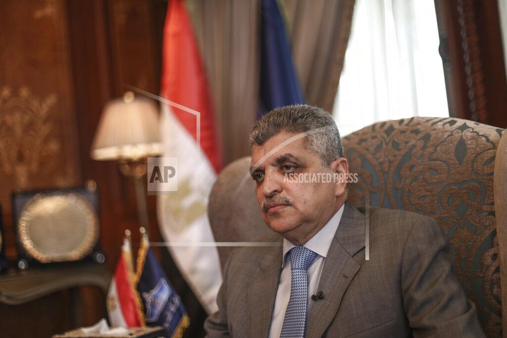 Mohamed Elshahed The Suez Canal chief Lt. Gen. Osama Rabie sits during an interview in Ismailia, Egypt, Tuesday, April 6, 2021. The Suez Canal chief said that authorities are negotiating a financial settlement with the owners of a massive vessel that blocked the crucial waterway for nearly a week. (AP Photo/Mohamed Elshahed)