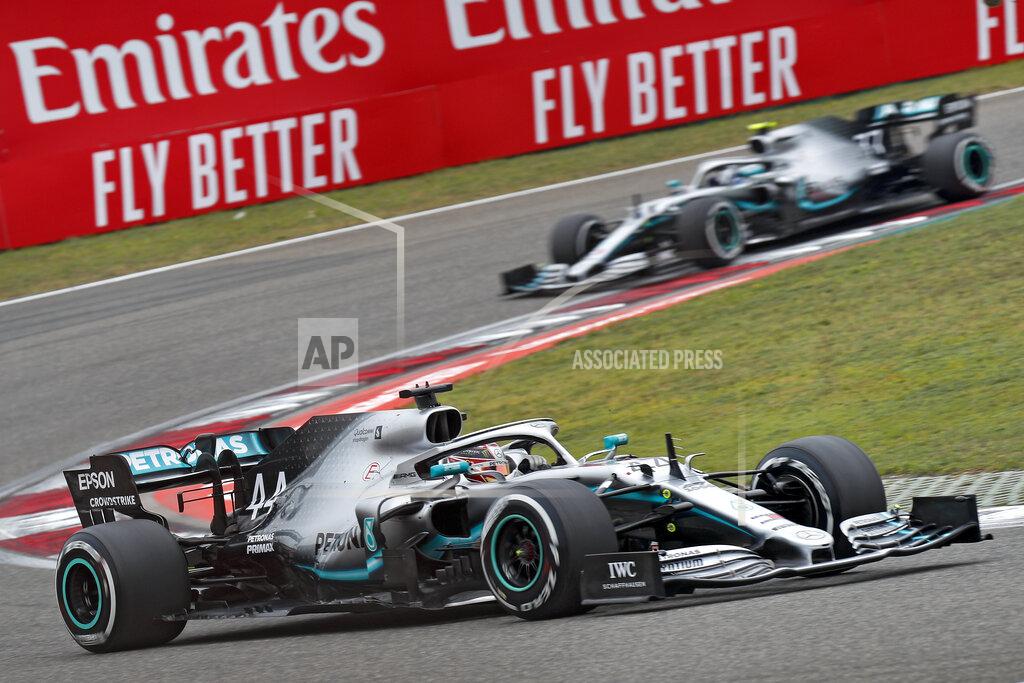 Andy Wong Mercedes driver Lewis Hamilton of Britain steers his car ahead of his teammate Valtteri Bottas of Finland during the Chinese Formula One Grand Prix at the Shanghai International Circuit in Shanghai, Sunday, April 14, 2019. (AP Photo/Andy Wong)