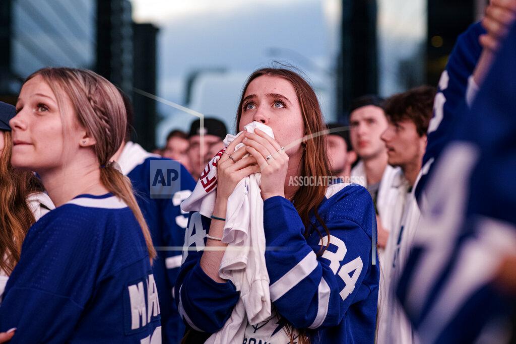 Christopher Katsarov Fans react during Game 7 of an NHL hockey first-round playoff series between the Toronto Maple Leafs and the Tampa Bay Lightning in Toronto, Saturday May 14, 2022. (Christopher Katsarov/The Canadian Press via AP)