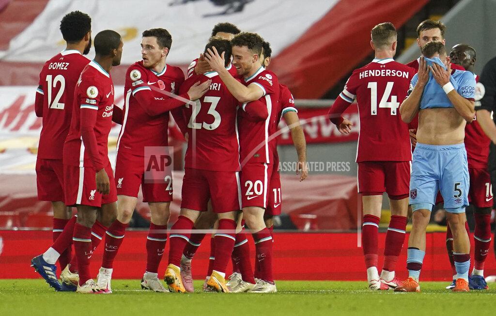 Jon Super Liverpool's Diogo Jota celebrates scoring his sides second goal during the English Premier League soccer match between Liverpool and West Ham United at Anfield stadium in Liverpool, England, Saturday, Oct. 31, 2020. (AP Photo/Jon Super, Pool)
