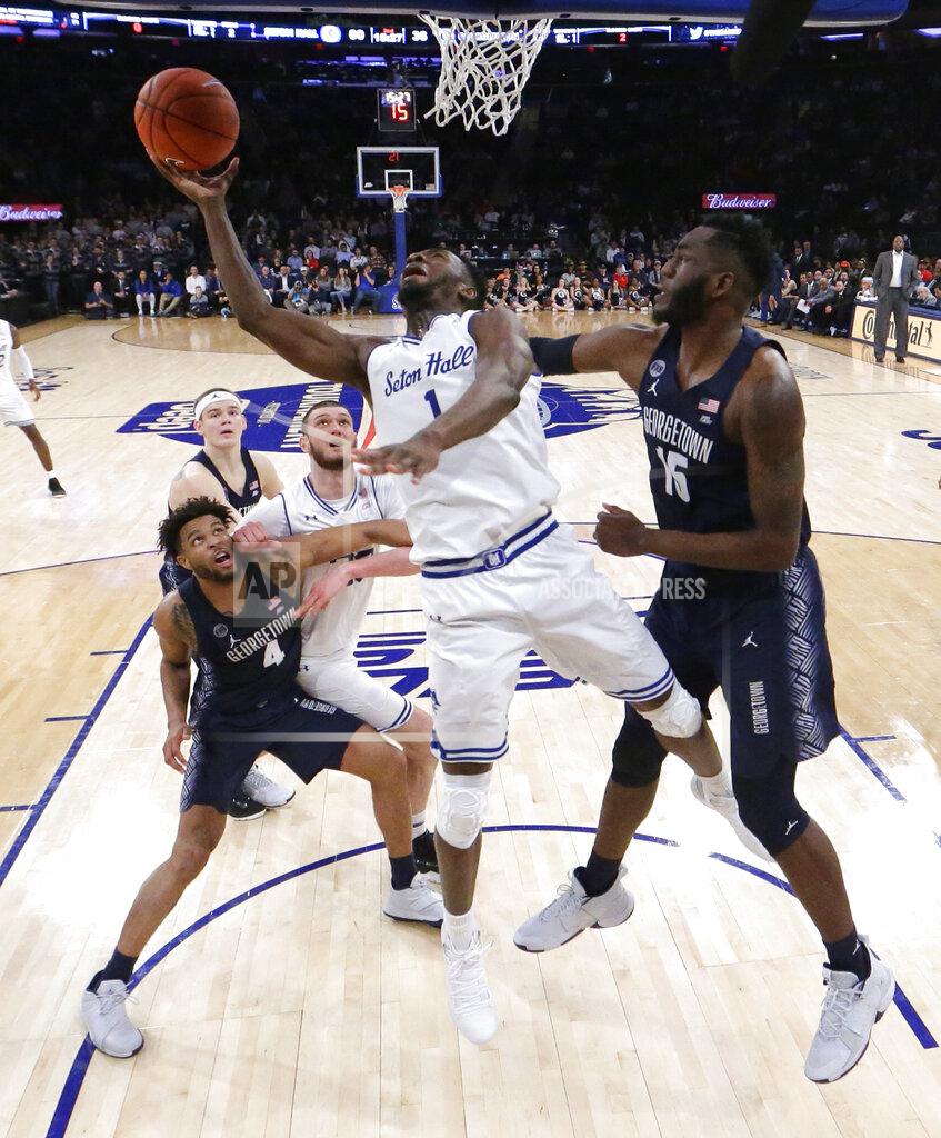 Julio Cortez Seton Hall forward Michael Nzei (1) goes up for a shot against Georgetown center Jessie Govan (15) during the second half of an NCAA college basketball game in the Big East men's tournament, Thursday, March 14, 2019, in New York. Seton Hall won 73-57. (AP Photo/Julio Cortez)