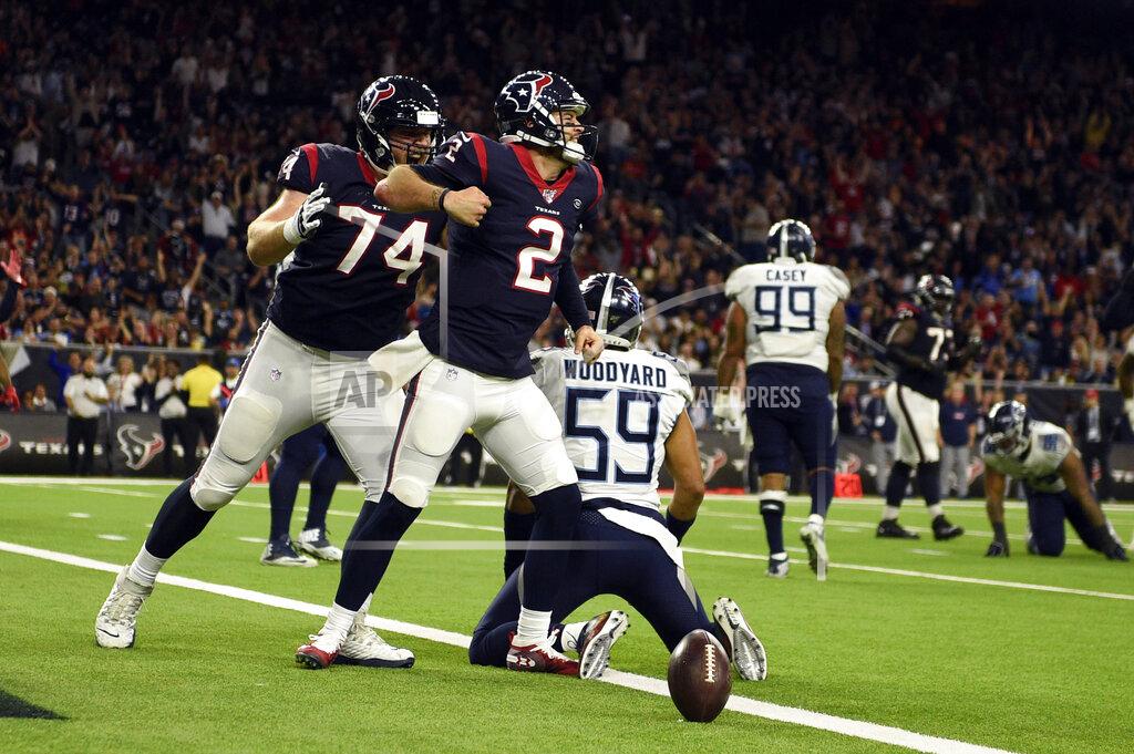 Eric Christian Smith Houston Texans quarterback AJ McCarron (2) celebrates after scoring a touchdown as offensive guard Max Scharping (74) joins him while Tennessee Titans inside linebacker Wesley Woodyard (59) kneels at the goal line during the second half of an NFL football game Sunday, Dec. 29, 2019, in Houston. (AP Photo/Eric Christian Smith)