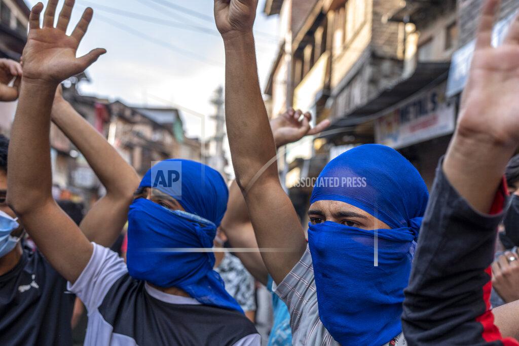 Dar Yasin Protesters shout slogans during a protest against sentencing of Kashmiri separatist leader Yasin Malik, in Srinagar, Indian controlled Kashmir, Wednesday, May 25, 2022. An Indian court sentenced a Kashmiri separatist leader to life in prison on Wednesday after finding him guilty of terrorism and sedition, triggering a clash between protesters and police and a partial shutdown of businesses in the Indian-controlled portion of Kashmir. (AP Photo/Dar Yasin)