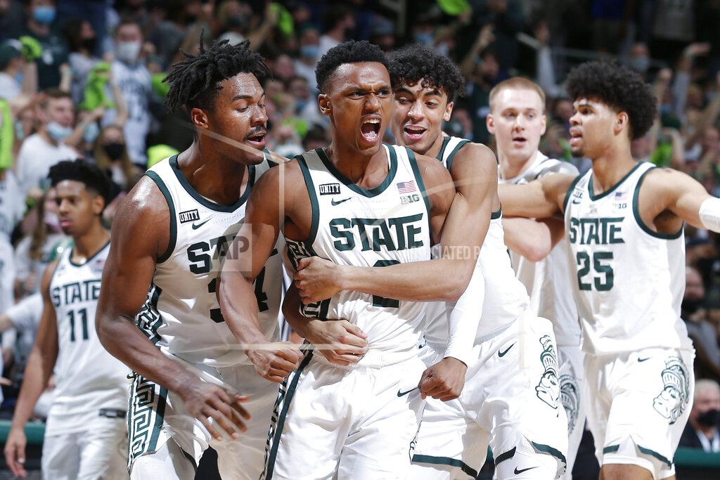 Al Goldis Michigan State's Tyson Walker, center, Julius Marble, left, and Max Christie, right, celebrate during the final seconds of the second half of an NCAA college basketball game against Purdue, Saturday, Feb. 26, 2022, in East Lansing, Mich. Michigan State won 68-65. (AP Photo/Al Goldis)