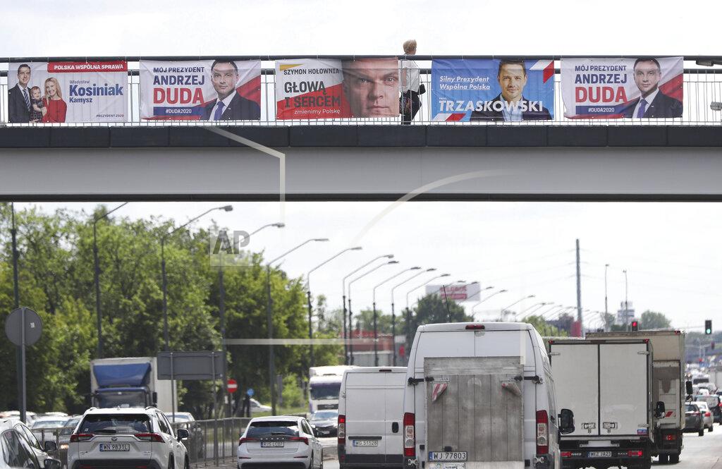 Czarek Sokolowski Electoral posters for Poland's conservative President Andrzej Duda and his three main challengers in Sunday's presidential election placed above a major thoroughfare n Warsaw, Poland, Tuesday, June 23, 2020.Centrist Warsaw Mayor Rafal Trzaskowski is considered Duda's main challenger who could face the incumbent in a runoff.(AP Photo/Czarek Sokolowski)
