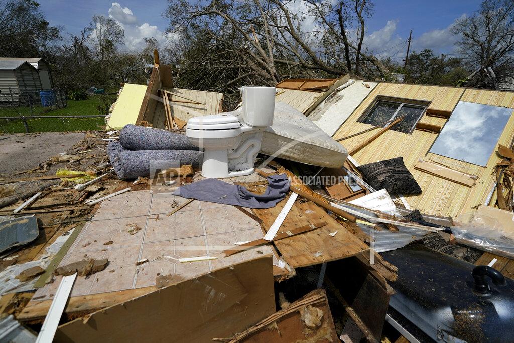 Gerald Herbert Remnants of the half destroyed mobile home of James Towfley, who is living in the standing half, are seen in Lake Charles, La., in the aftermath of Hurricane Laura, Sunday, Aug. 30, 2020. (AP Photo/Gerald Herbert)