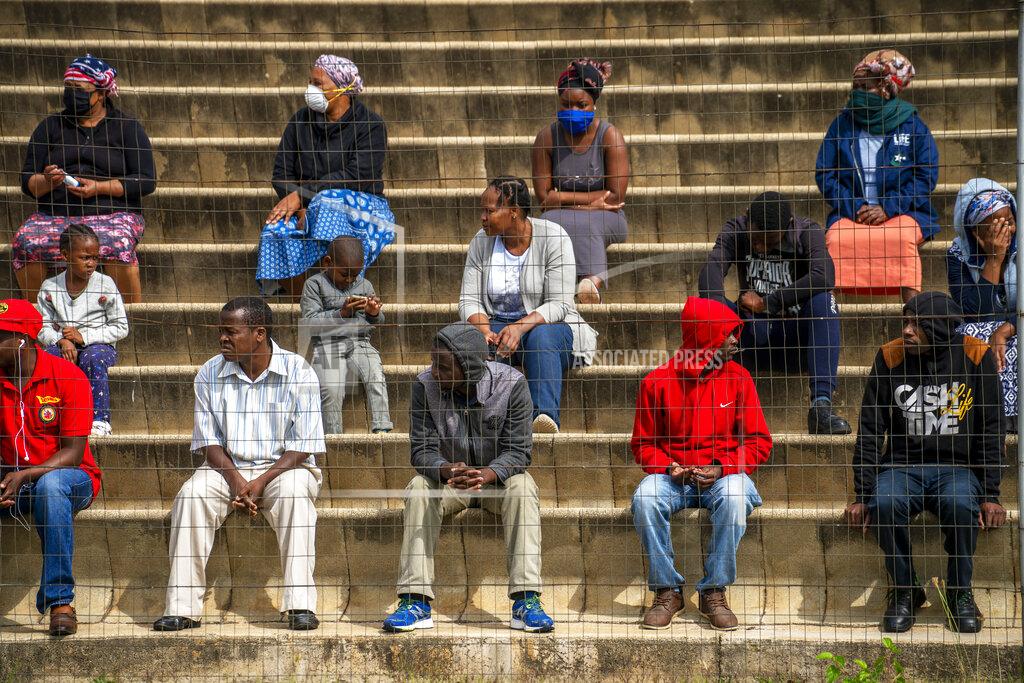 Jerome Delay Residents from the Alexandra township in Johannesburg gather in a stadium to be tested for COVID-19 Monday, April 26, 2020. South Africa will began a phased easing of its strict lockdown measures on May 1, although its confirmed cases of coronavirus continue to increase. (AP Photo/Jerome Delay)