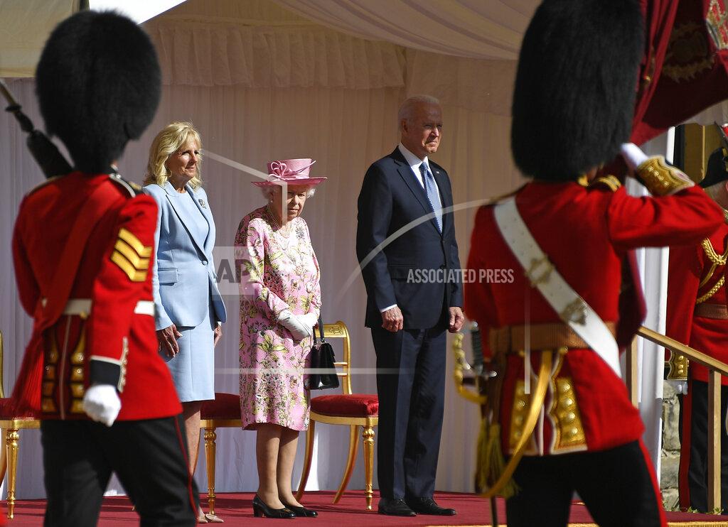 Alberto Pezzali US President Joe Biden takes a salute from a Guard of Honour after arriving with First Lady Jill Biden to meet Britain's Queen Elizabeth II at Windsor Castle near London, Sunday, June 13, 2021. (AP Photo/Alberto Pezzali)