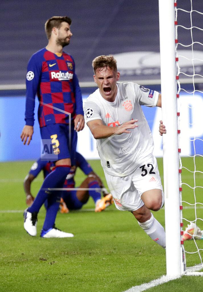 Manu Fernandez Bayern's Joshua Kimmich celebrates after scoring his sides fifth goal during the Champions League quarterfinal match between FC Barcelona and Bayern Munich at the Luz stadium in Lisbon, Portugal, Friday, Aug. 14, 2020. (AP Photo/Manu Fernandez/Pool)
