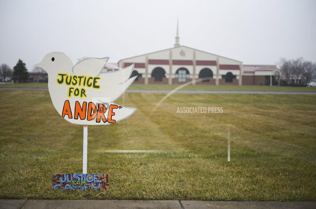 Signs reading "Justice for Andre'" and "Justice for Casey," in reference to Andre' Hill and Casey Goodson Jr., both Black men killed at the hands of law enforcement in Columbus, sit outside the First Church of God before the funeral of Andre Hill on Tuesday, Jan. 5, 2021 in Columbus, Ohio. Hill, a 47-year-old Black man, was shot and killed by Columbus Division of Police Officer Adam Coy in the early morning of Dec. 22, 2020 after officers responded to a non-emergency call in the area. (Joshua A. Bickel/The Columbus Dispatch via AP)