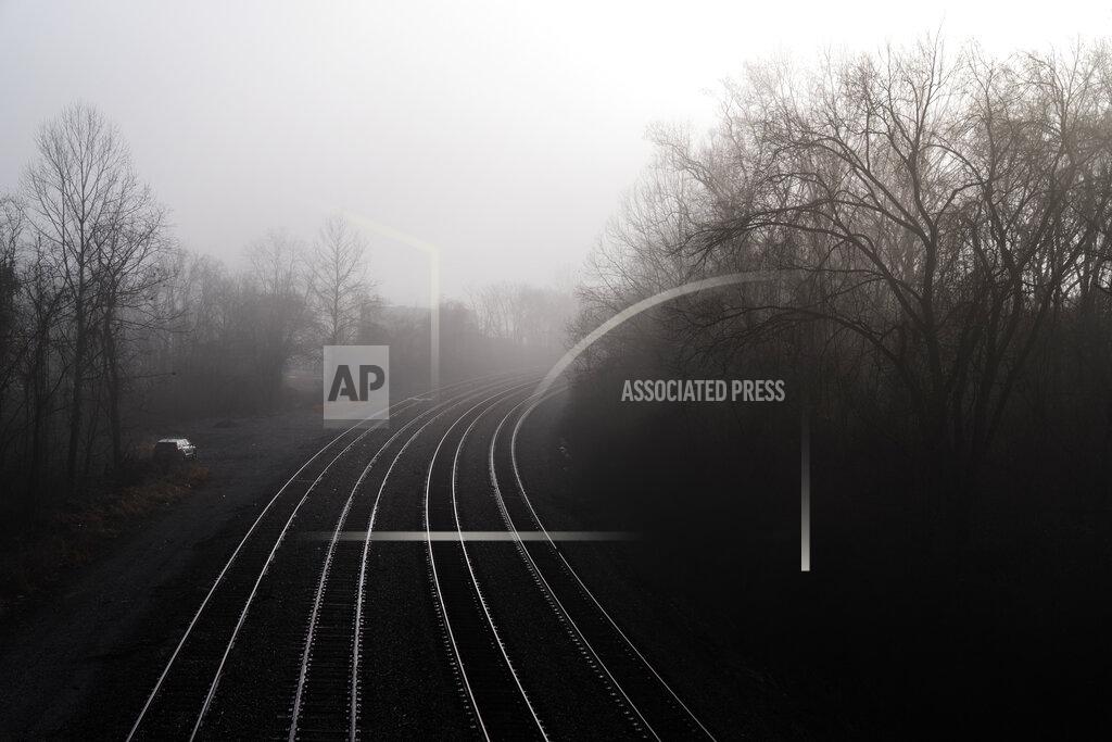 David Goldman A police patrol vehicle sits along a stretch of railroad tracks in Huntington, W.Va., Wednesday, March 17, 2021. Huntington was once a thriving industrial town of almost 100,000 people. It sits at the corner of West Virginia, Kentucky and Ohio, and the railroad tracks through town used to rumble all day from trains packed with coal. Then the coal industry collapsed, and the trains don't come so much anymore. (AP Photo/David Goldman)