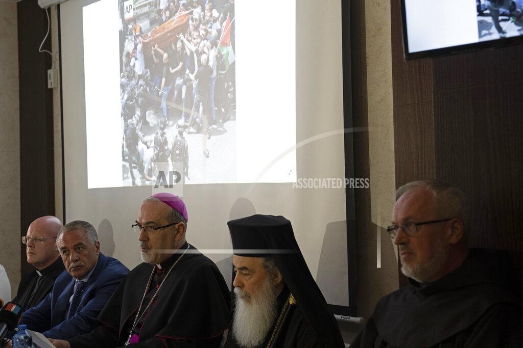 Maya Alleruzzo The Latin Patriarch of Jerusalem Pierbattista Pizzaballa, center, speaks during a press conference, flanked by Jamil Koussa, General Director of St. Joseph's Hospital, center left, and Greek Patriarch of Jerusalem, Theophilos III, about police violence against pallbearers at the funeral of slain Al Jazeera correspondent Shireen Abu Akleh, in east Jerusalem, Monday, May 16, 2022. After an international uproar over the funeral violence, Israeli police launched an investigation into the conduct of the officers who attacked the mourners, causing the pallbearers to nearly drop her coffin. (AP Photo/ Maya Alleruzzo)