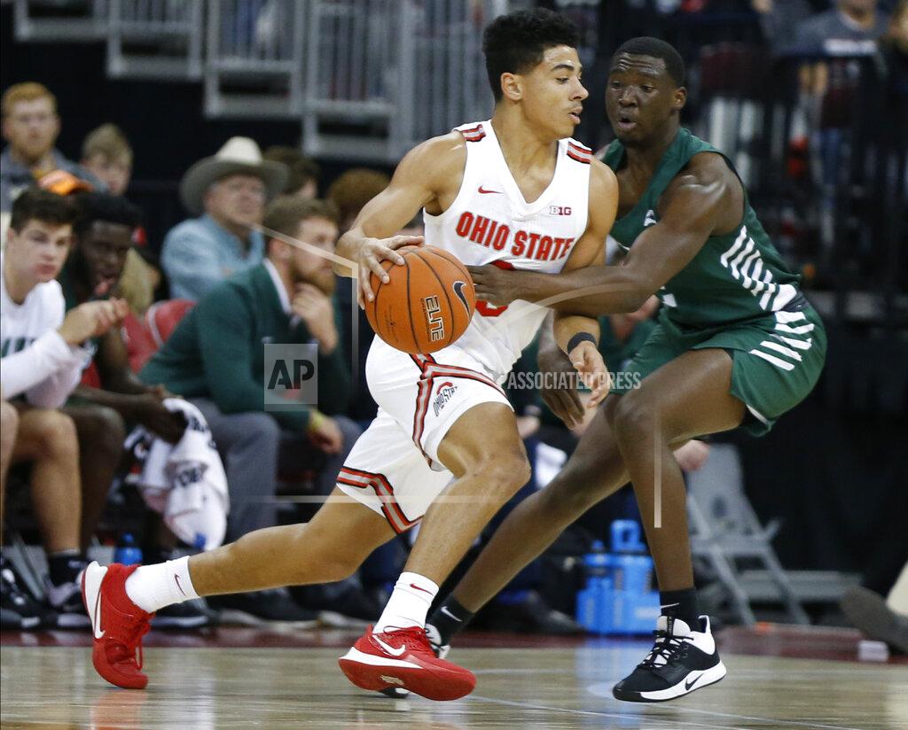 Jay Laprete Ohio State's D.J. Carton, left, tries to dribble past Stetson's Rob Perry during the first half of an NCAA college basketball game Monday, Nov. 18, 2019, in Columbus, Ohio. (AP Photo/Jay LaPrete)