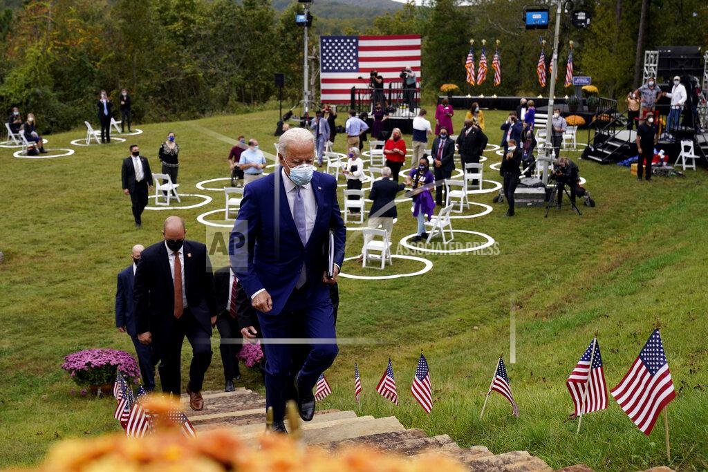 Andrew Harnik FILE - In this Oct. 27, 2020, file photo, then-Democratic presidential candidate former Vice President Joe Biden leaves after speaking at Mountain Top Inn & Resort in Warm Springs, Ga. President-elect Joe Biden has evoked Franklin Delano Roosevelt in promising a remaking of America unseen since the New Deal. Pledging to emulate some of the loftiest reforms in the nation’s history has left him with towering promises to keep. And Biden hopes to deliver against the backdrop of the pandemic and searing national division. (AP Photo/Andrew Harnik, file)